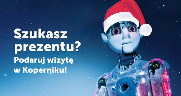 Niebieskie, gwiaździste tło z robotem w czapce Mikołaja, obok napis "Szukasz prezentu?"
